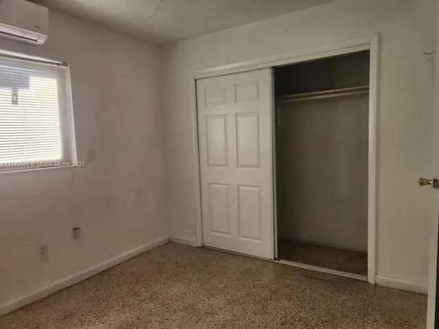 an empty room with closet