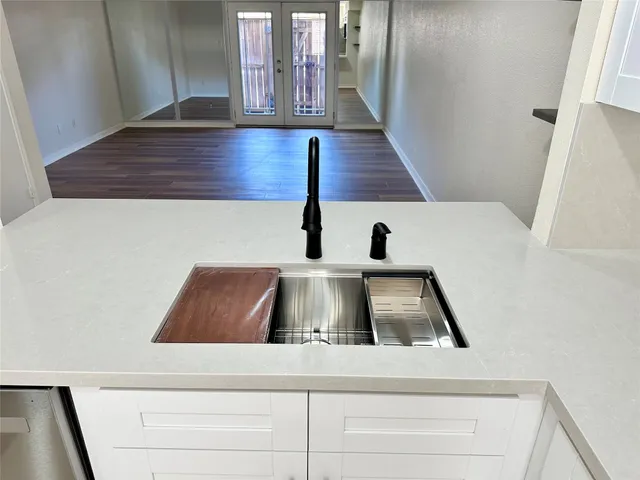 a view of staircase with white walls