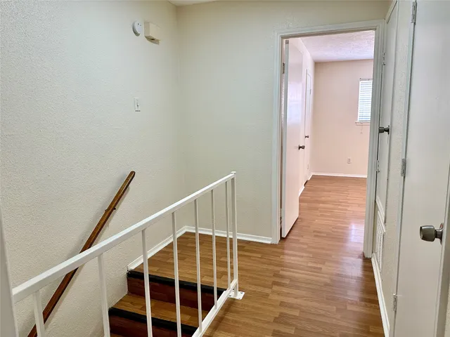 a view of entryway with wooden floor