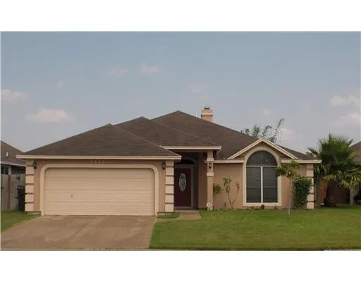 a house view with a garden space