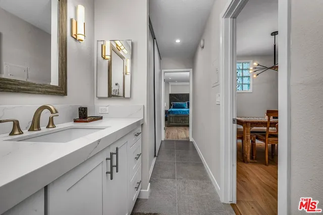 a en suite bathroom with a sink and a mirror