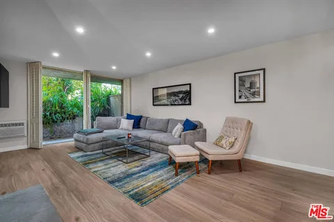 a living room with furniture and a gate