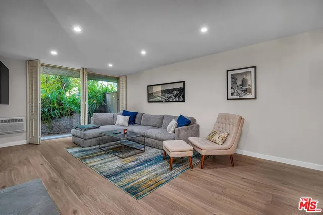 a living room with furniture and a gate