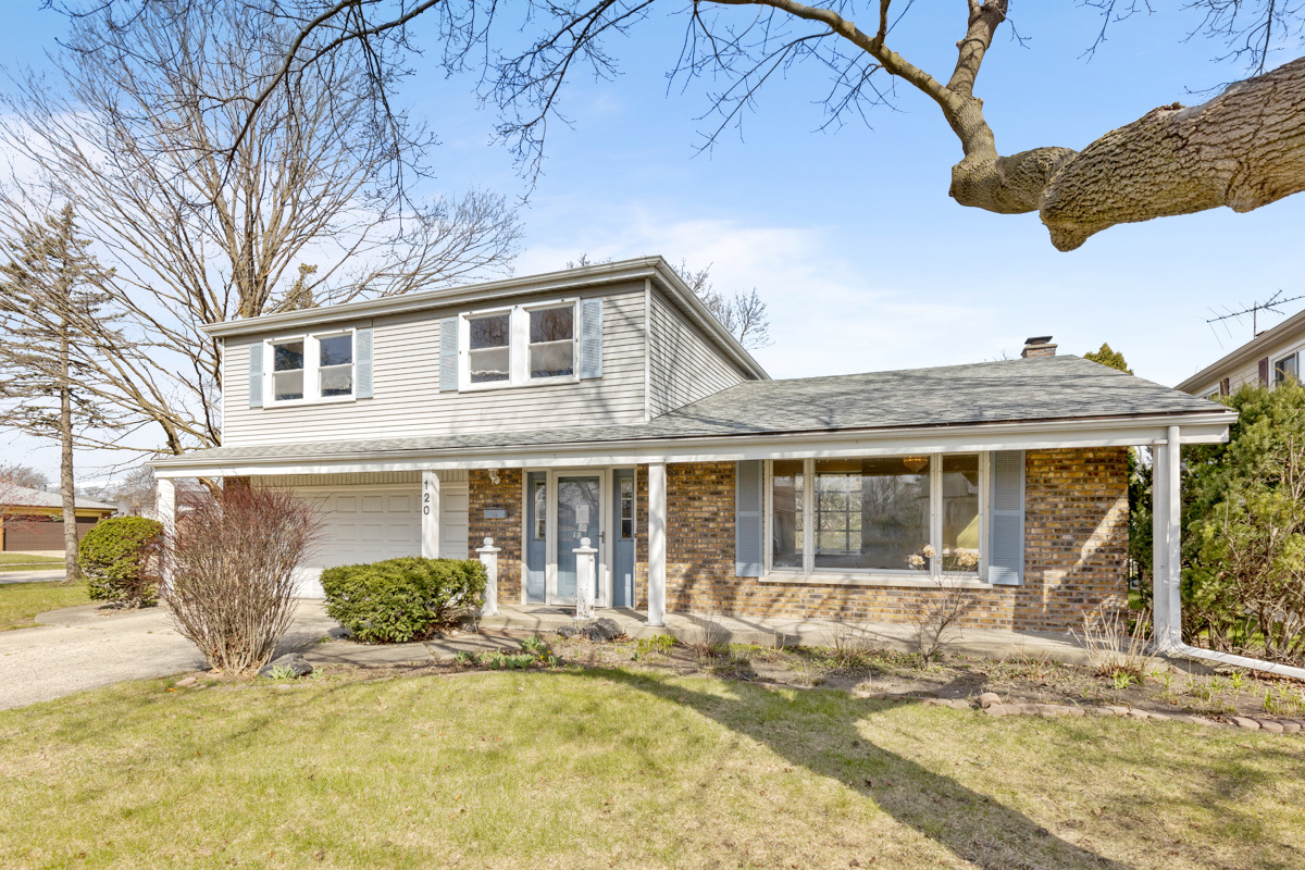 120 Ambleside Road Des Plaines, IL 60016 - Photo 1 of 22 a front view of a house with a yard outdoor seating and yard