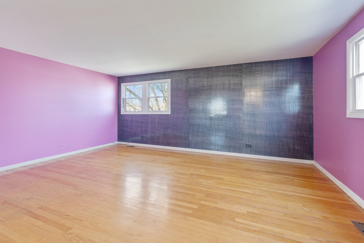 120 Ambleside Road Des Plaines, IL 60016 - Photo 13 of 22 a view of empty room with wooden floor and fan