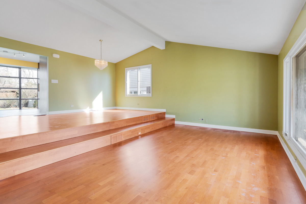 120 Ambleside Road Des Plaines, IL 60016 - Photo 4 of 22 a view of room with window and wooden floor