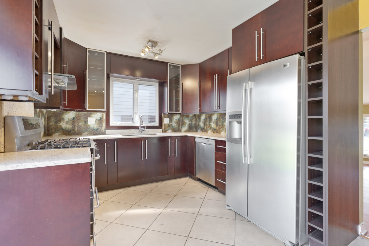 120 Ambleside Road Des Plaines, IL 60016 - Photo 8 of 22 a kitchen with stainless steel appliances kitchen island granite countertop a refrigerator and a sink