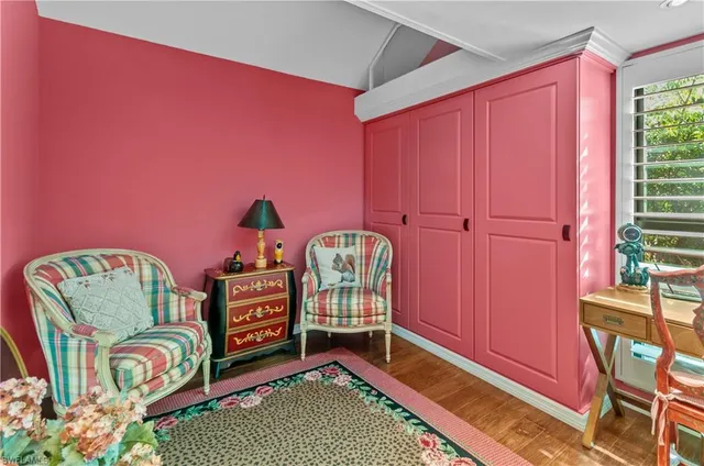 a bedroom with furniture and a window