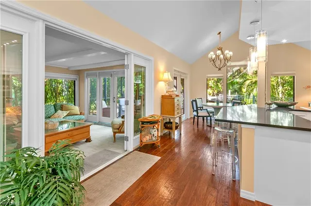 a large living room with furniture and a large window