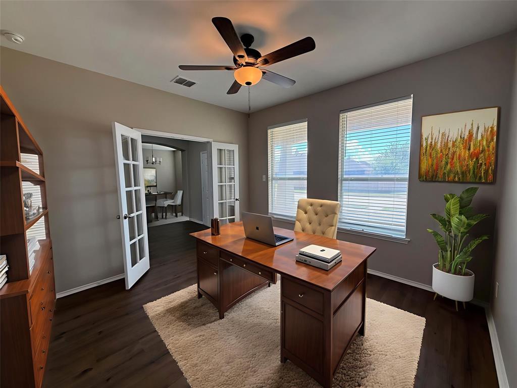 109 Rockbrook Drive Wylie, TX 75098 - Photo 16 of 34 a work room with furniture and wooden floor