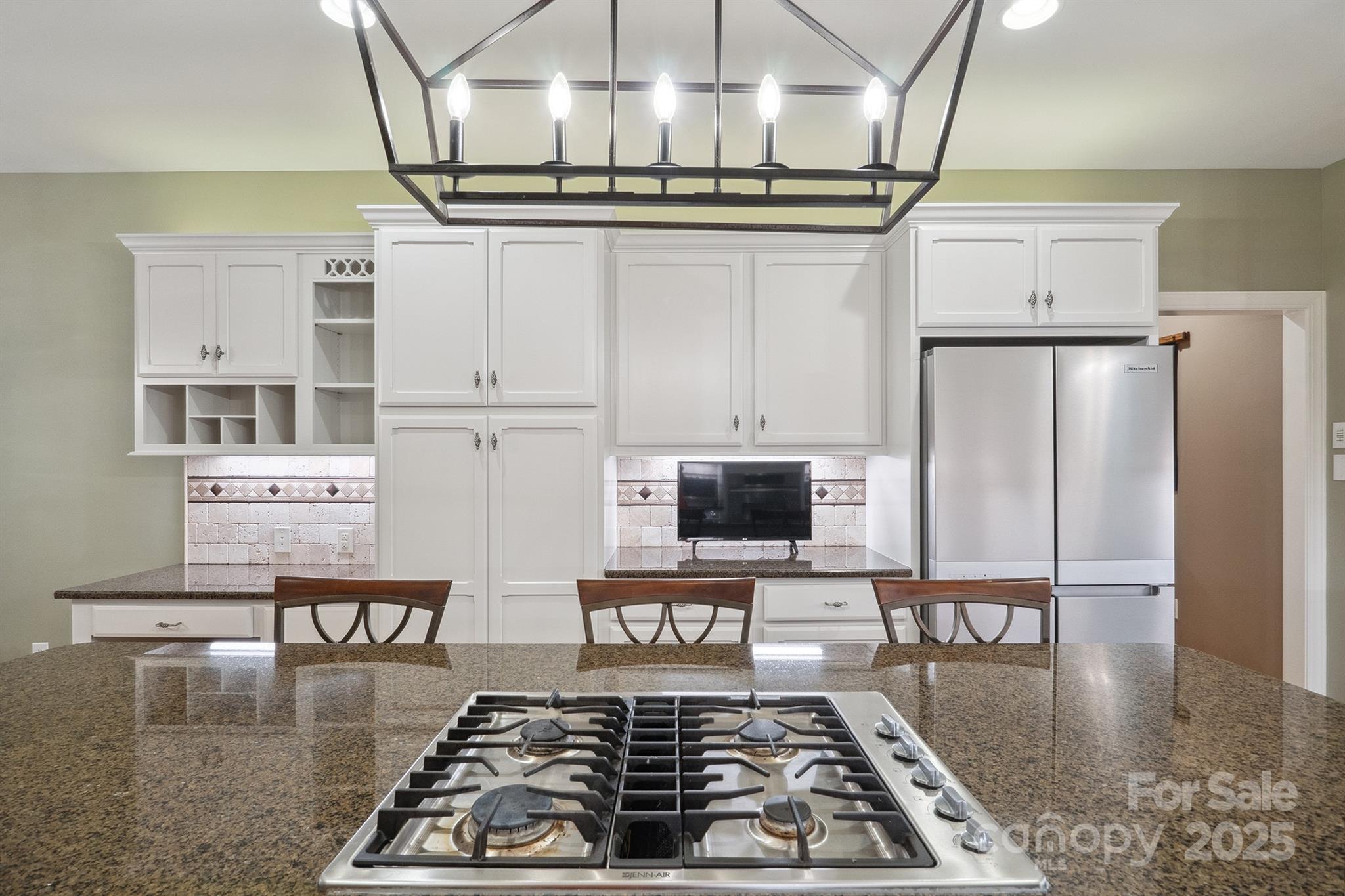 270 North Street Salisbury, NC 28147 - Photo 24 of 48 a kitchen with stainless steel appliances granite countertop a stove a sink and a refrigerator