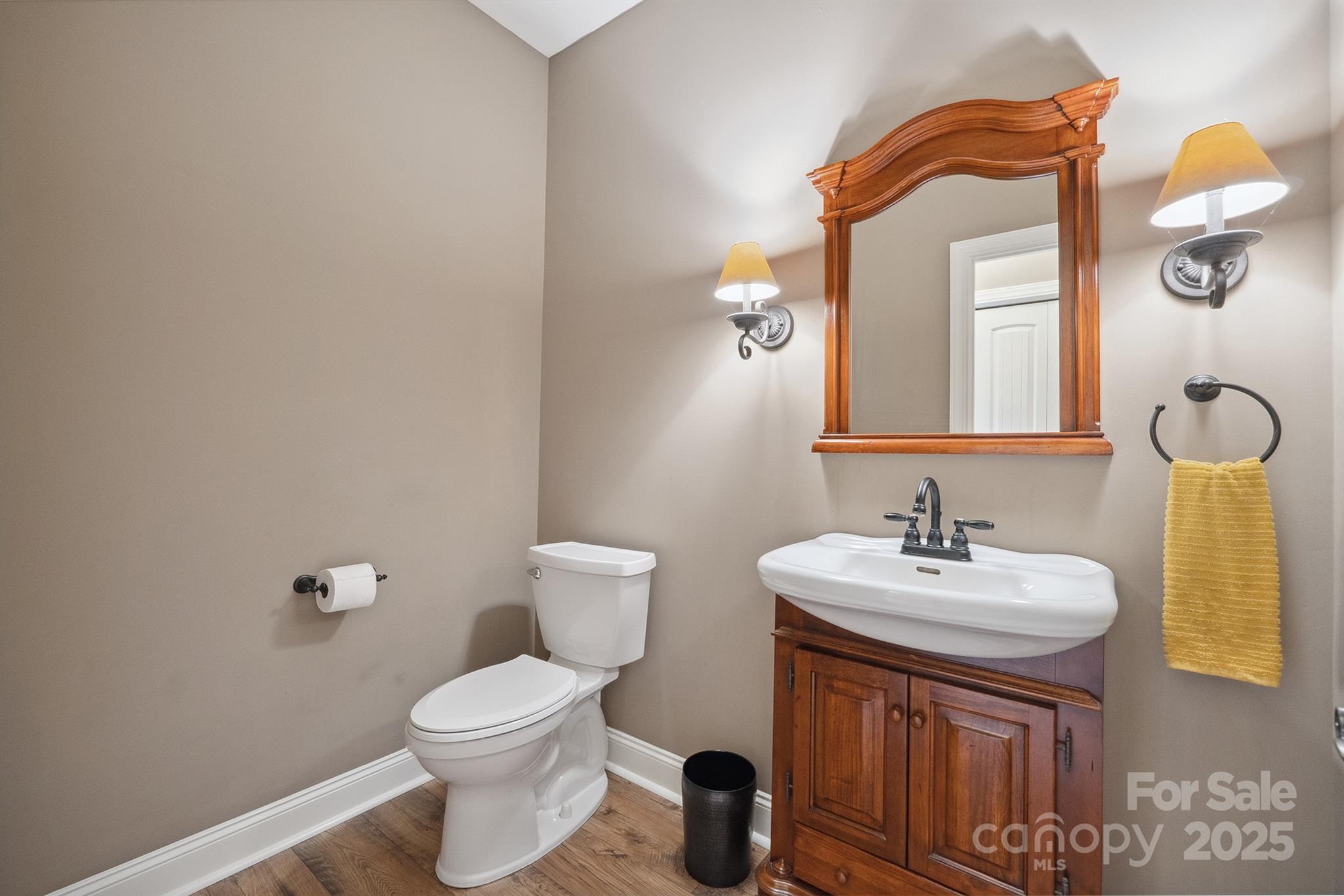 270 North Street Salisbury, NC 28147 - Photo 27 of 48 a bathroom with a toilet a sink and mirror