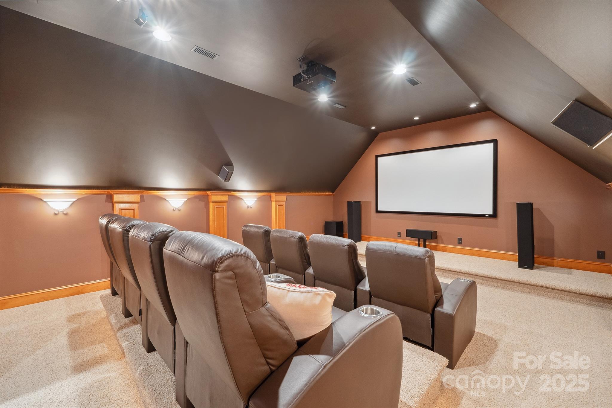 270 North Street Salisbury, NC 28147 - Photo 31 of 48 a media room with lots of chairs and a projector screen