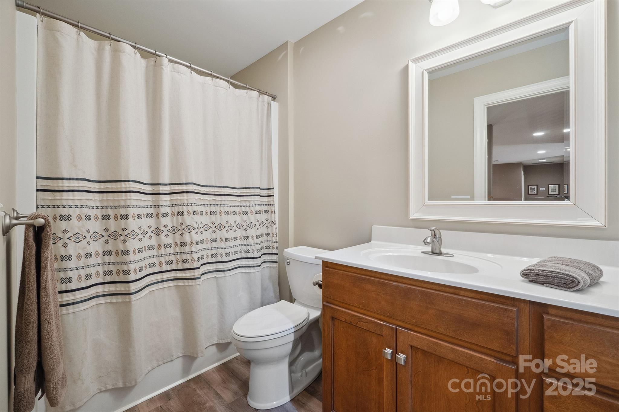 270 North Street Salisbury, NC 28147 - Photo 37 of 48 a bathroom with a granite countertop sink toilet and mirror
