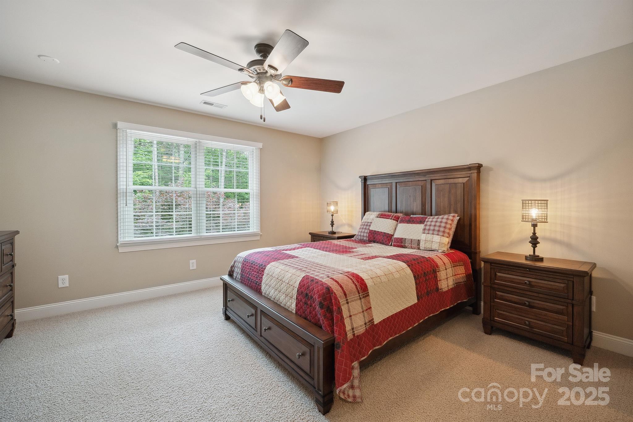 270 North Street Salisbury, NC 28147 - Photo 38 of 48 a spacious bedroom with a bed and a chandelier