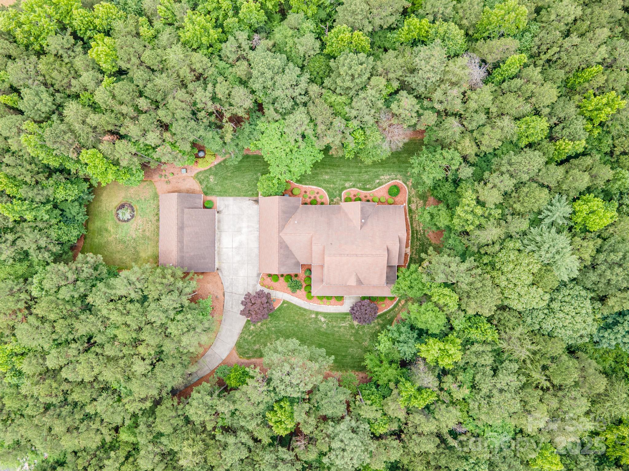 270 North Street Salisbury, NC 28147 - Photo 4 of 48 an aerial view of a house with a yard and trees all around