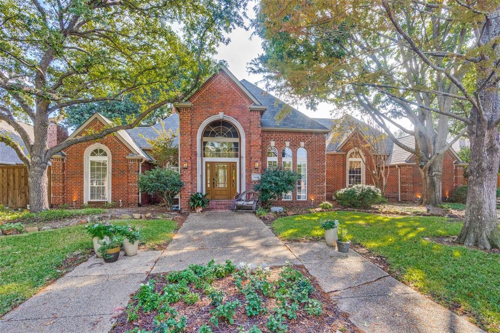 3452 Hearst Castle Way Plano, TX 75025 - Photo 1 of 36 a front view of a house with a yard and outdoor seating