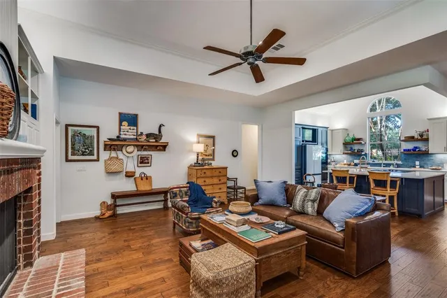 a living room with furniture fireplace and flat screen tv