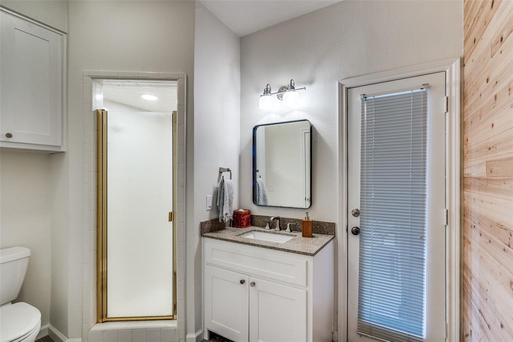 3452 Hearst Castle Way Plano, TX 75025 - Photo 22 of 36 a bathroom with a granite countertop sink and a mirror