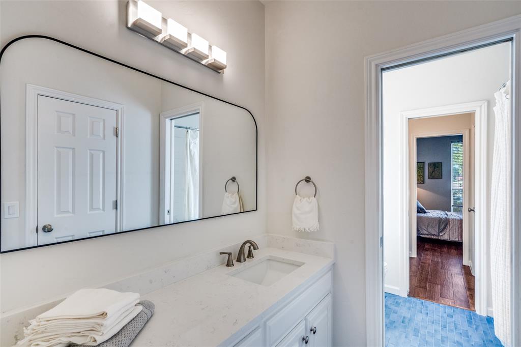 3452 Hearst Castle Way Plano, TX 75025 - Photo 24 of 36 a bathroom with a sink and a mirror