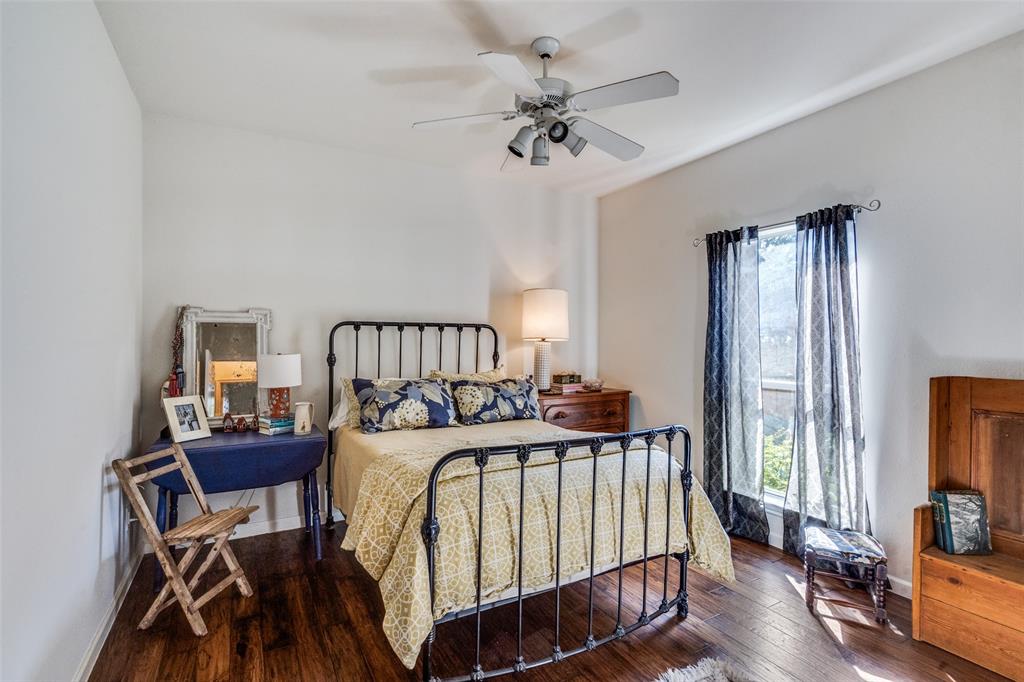3452 Hearst Castle Way Plano, TX 75025 - Photo 25 of 36 a bedroom with a bed and a chandelier
