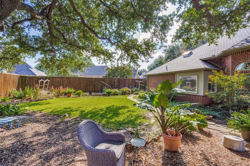 3452 Hearst Castle Way Plano, TX 75025 - Photo 34 of 36 a house view with a seating space and garden