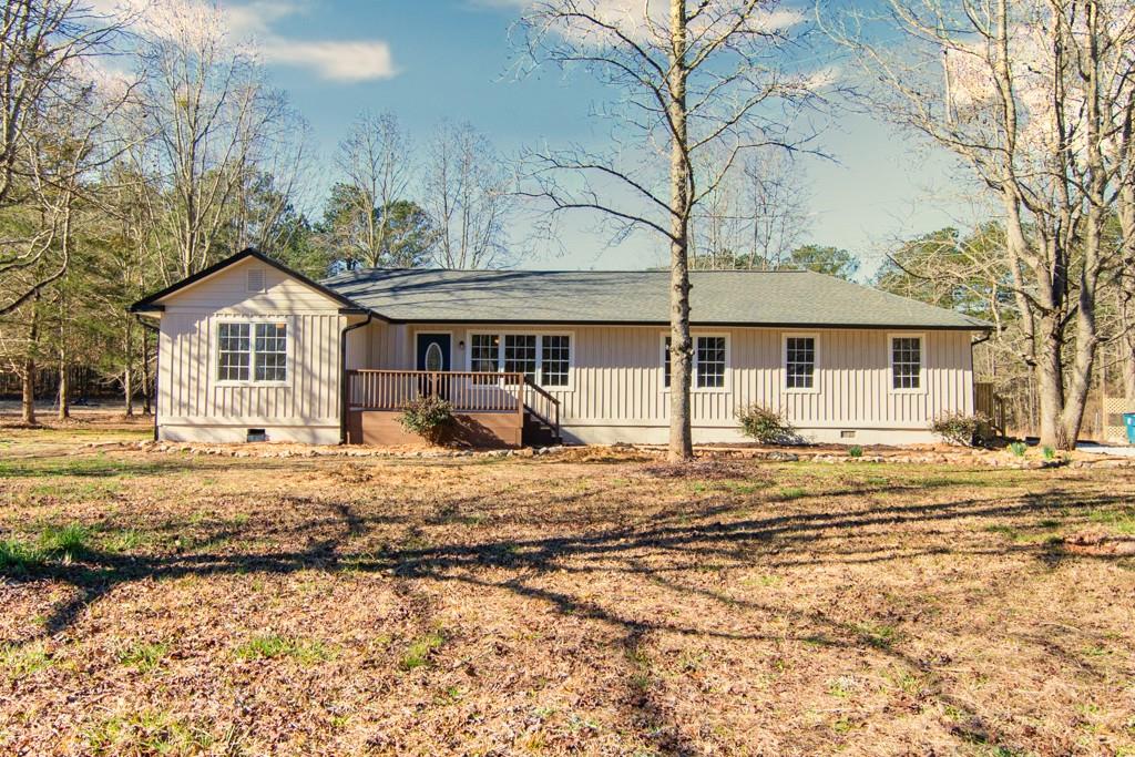 2751 Miranda Ridge Drive Monroe, GA 30655 - Photo 1 of 1 a house with trees in the background