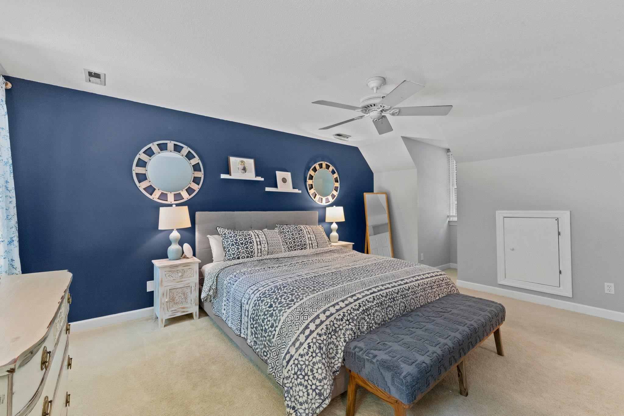 9301 Greenfield Drive Raleigh, NC 27615 - Photo 20 of 48 Ceiling fan and additional scuttle attic storage space. This room has 2 WICs; one in the bedroom and one in the bathroom. Primary Bedroom