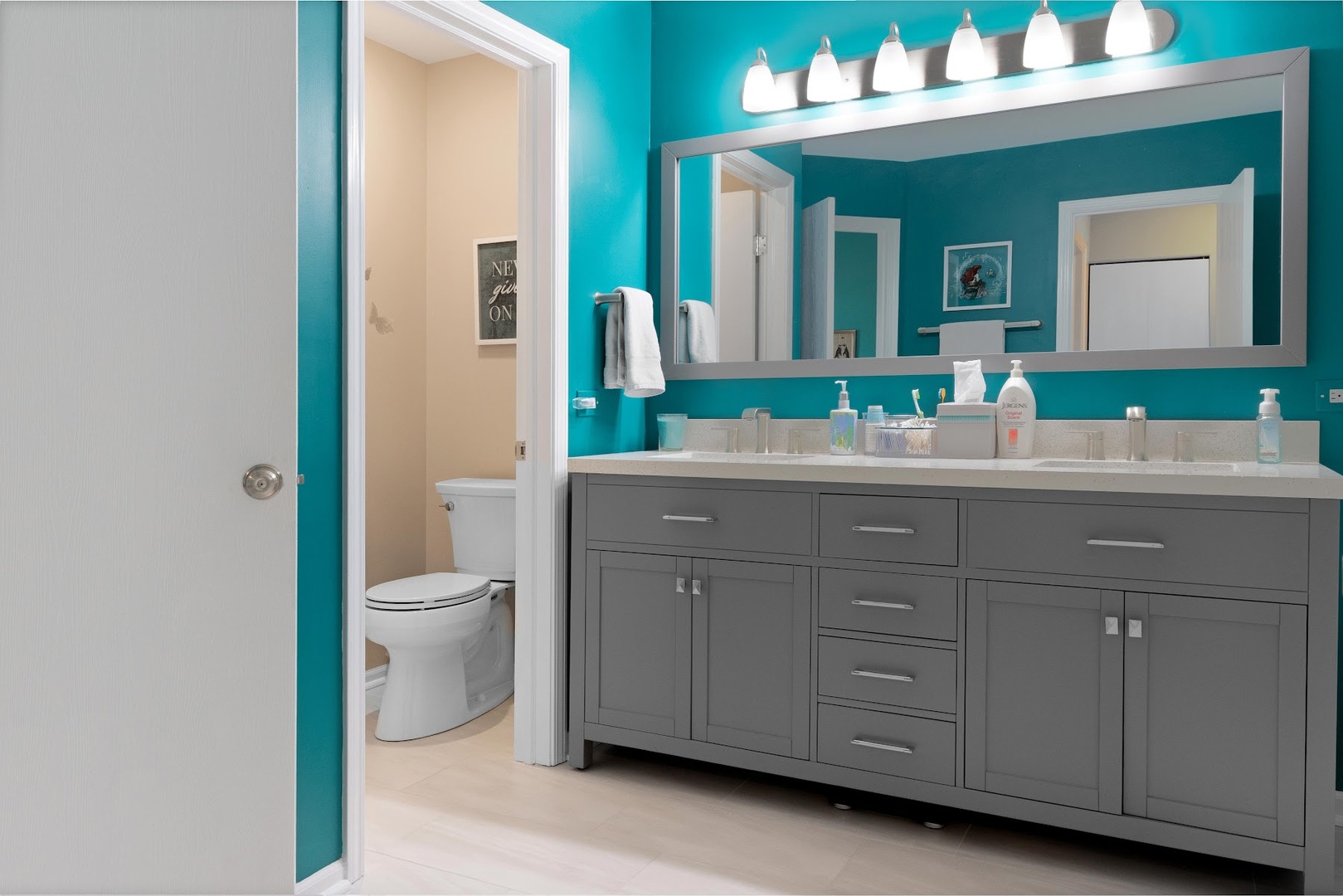 3484 Ravinia Circle Aurora, IL 60504 - Photo 14 of 26 a bathroom with a toilet a sink and mirror