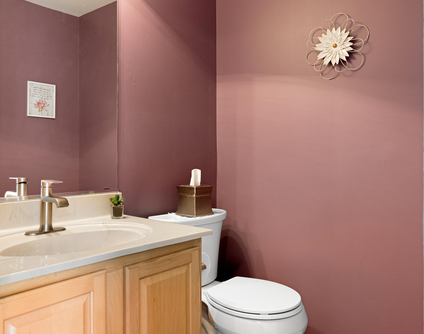 3484 Ravinia Circle Aurora, IL 60504 - Photo 18 of 26 a bathroom with a sink a toilet and a mirror