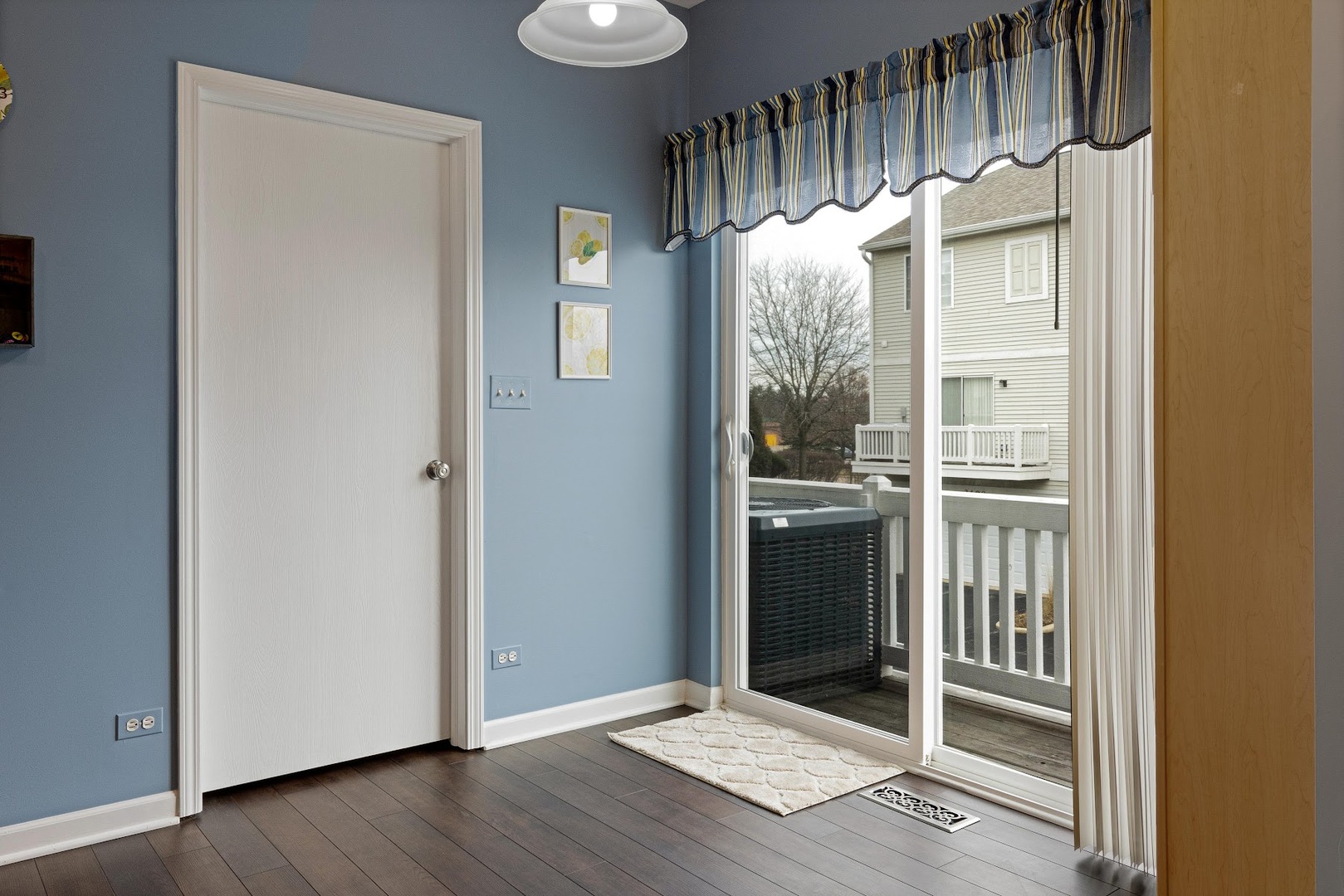 3484 Ravinia Circle Aurora, IL 60504 - Photo 19 of 26 an empty room with wooden floor windows and entryway