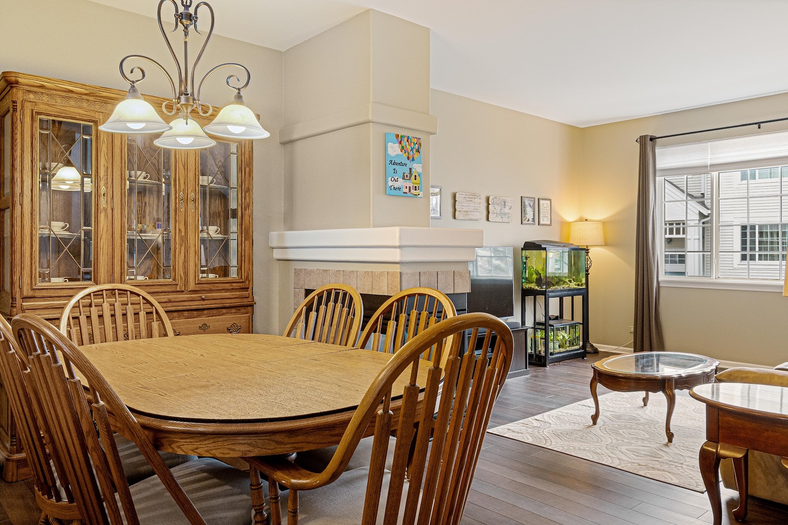 3484 Ravinia Circle Aurora, IL 60504 - Photo 22 of 26 a view of a dining room with furniture window and wooden floor