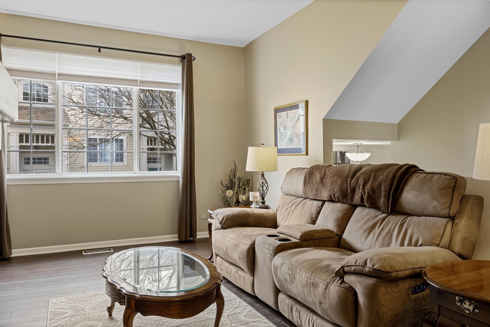 3484 Ravinia Circle Aurora, IL 60504 - Photo 24 of 26 a living room with furniture and a large window