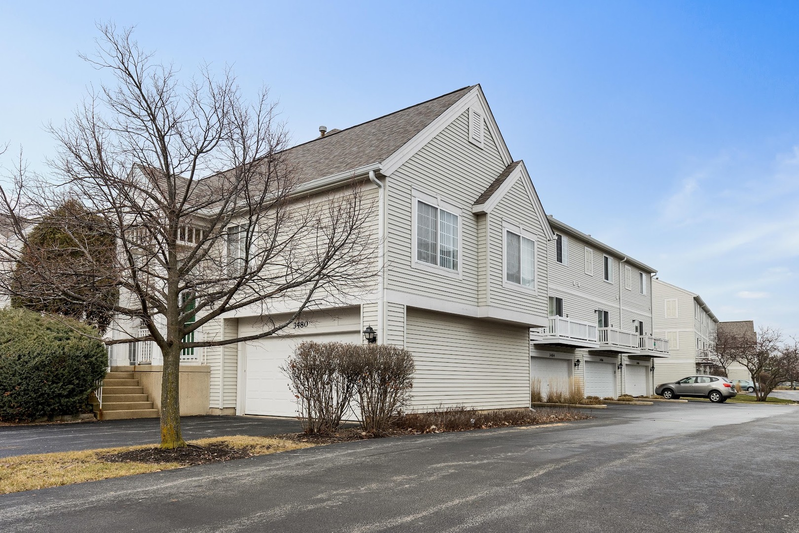 3484 Ravinia Circle Aurora, IL 60504 - Photo 25 of 26 a view of a street with big house