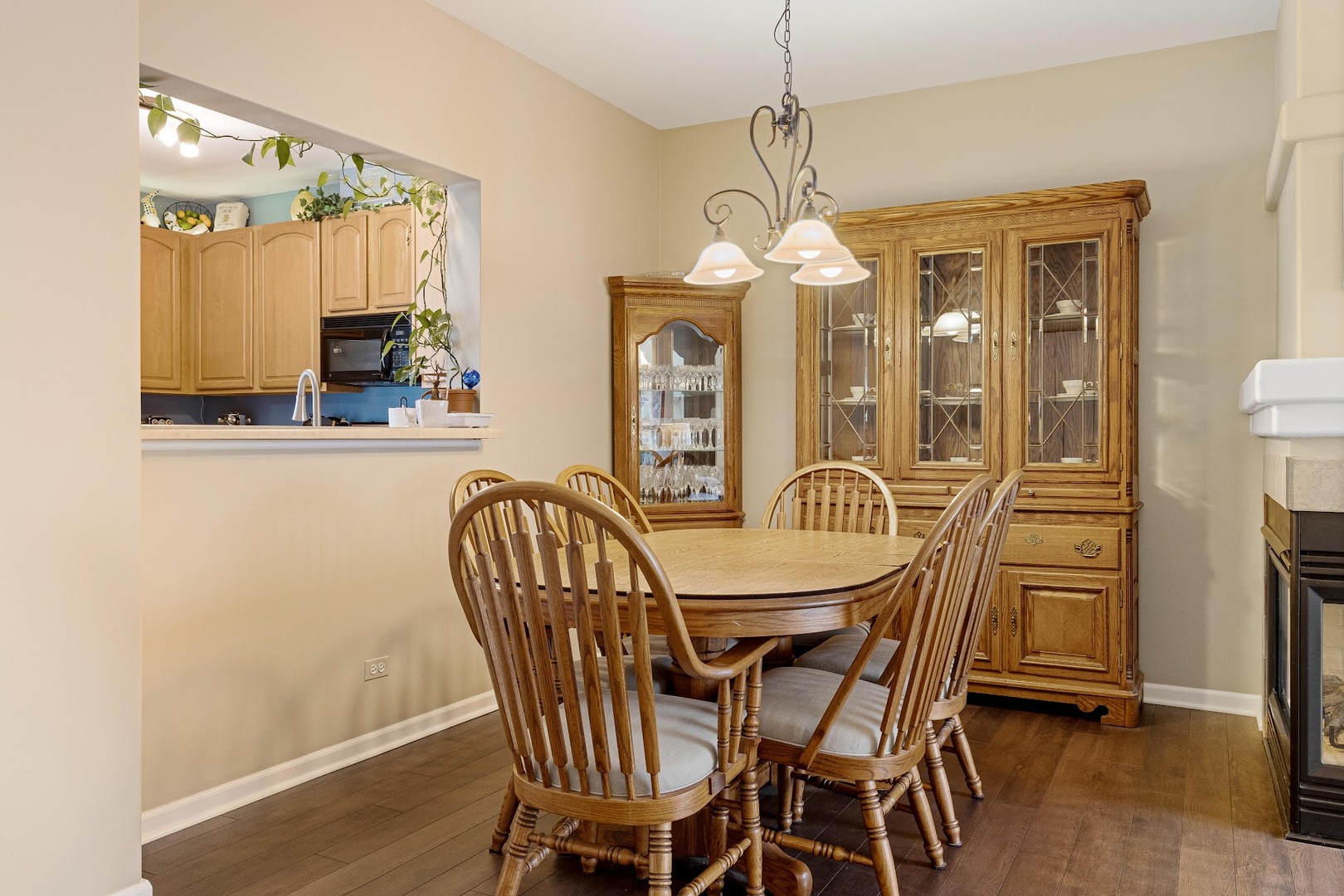 3484 Ravinia Circle Aurora, IL 60504 - Photo 4 of 26 a view of a dining room with furniture and a chandelier