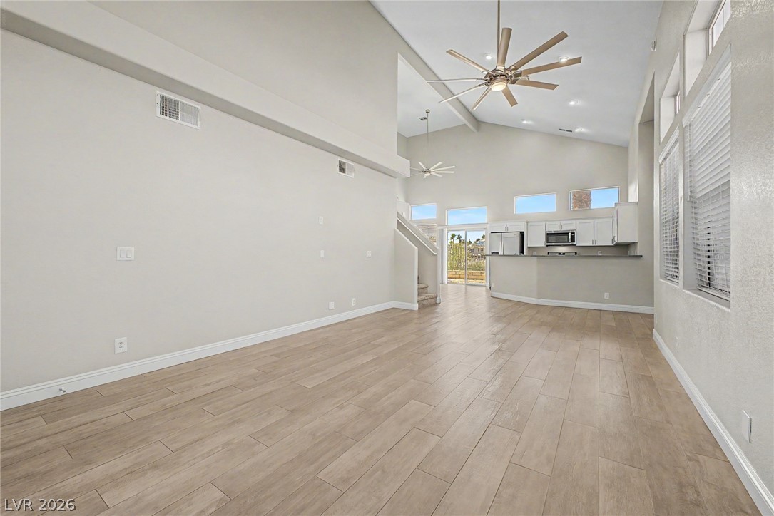 2316 Ramsgate Drive Henderson, NV 89074 - Photo 4 of 28 Vast living area flowing into a modern kitchen, crowned with soaring vaulted ceilings.
