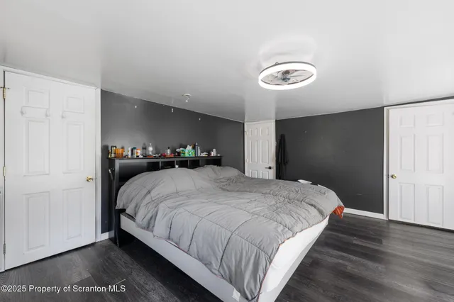 a bedroom with a bed and a closet