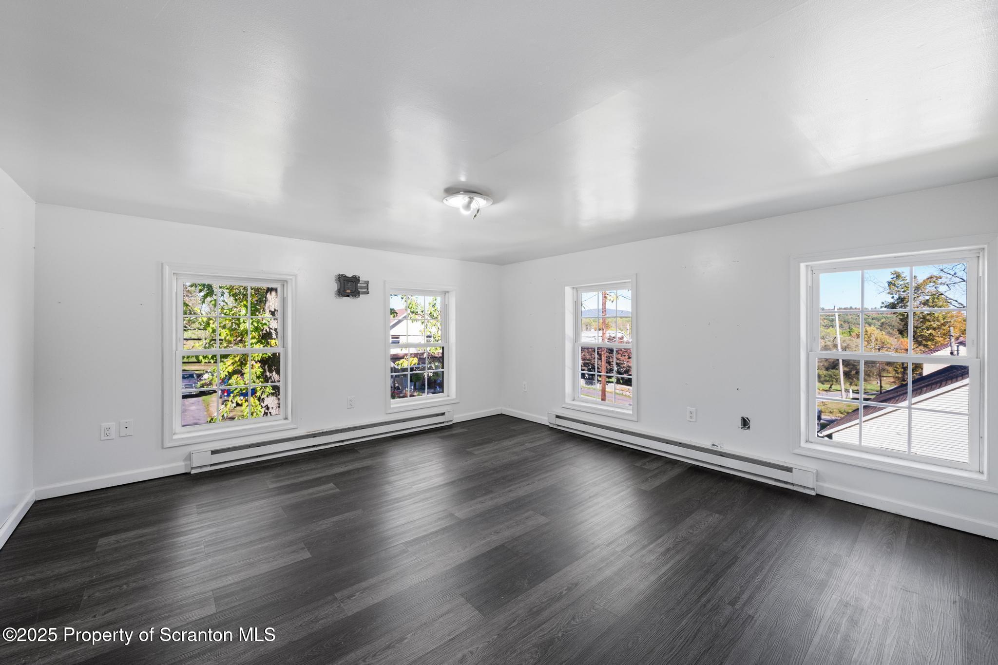 22 Creamery Road Tunkhannock, PA 18657 - Photo 17 of 39 an empty room with wooden floor and windows