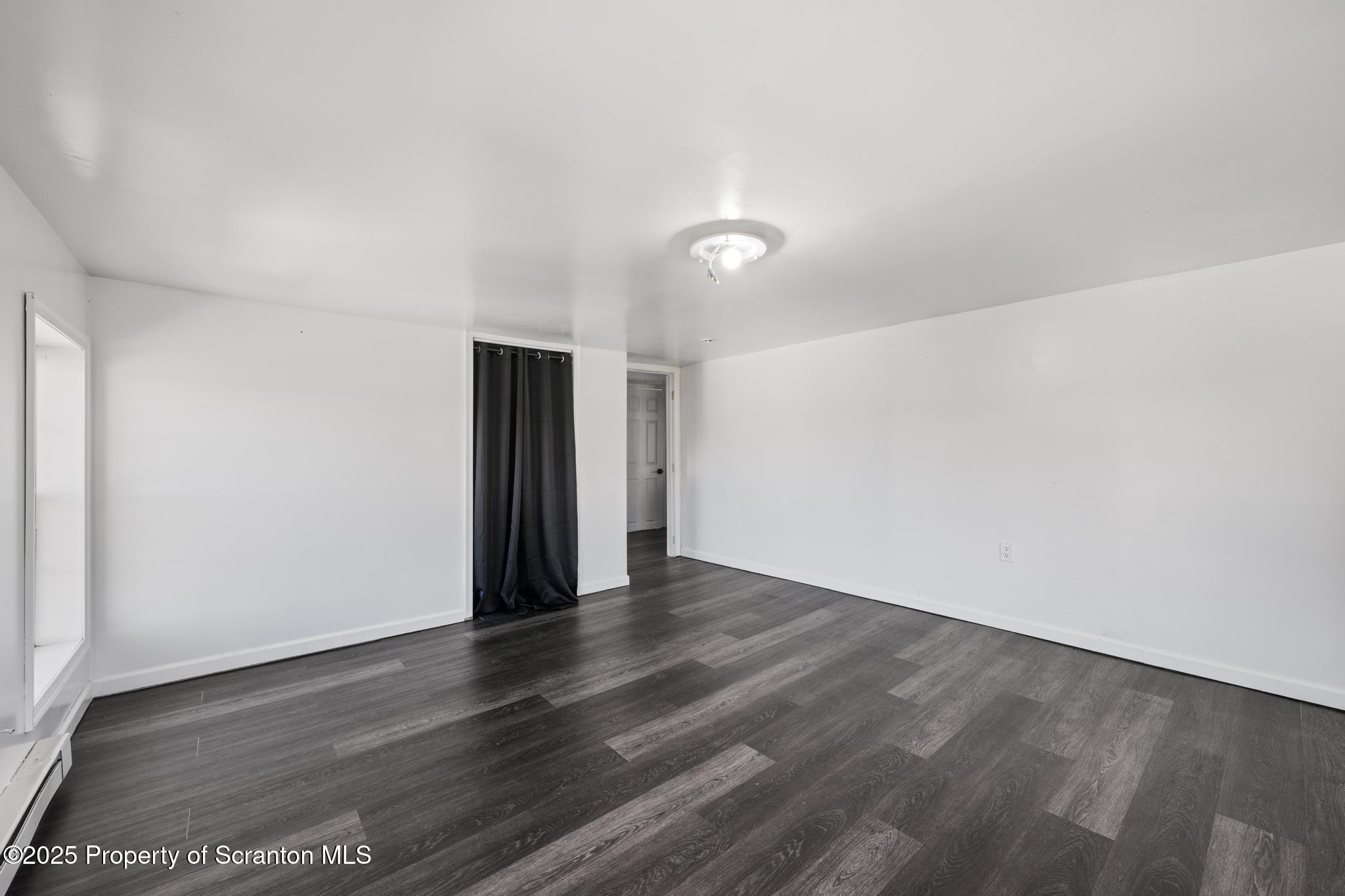 22 Creamery Road Tunkhannock, PA 18657 - Photo 18 of 39 a view of an empty room with wooden floor