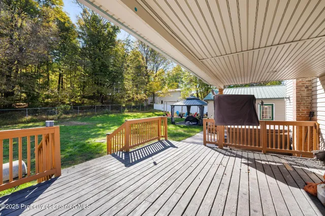 a view of a yard with furniture and garden