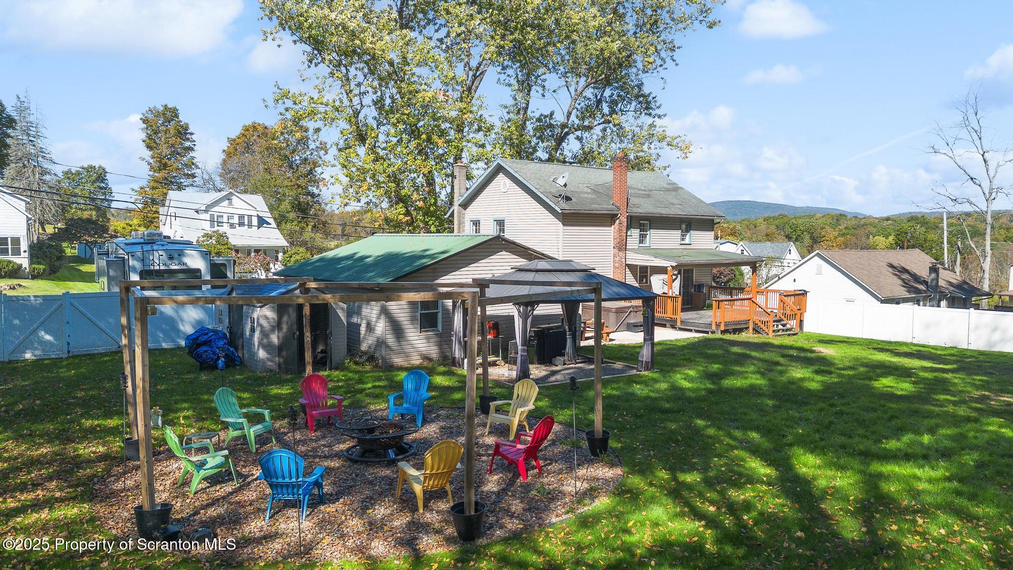 22 Creamery Road Tunkhannock, PA 18657 - Photo 34 of 39 a view of a white house with a big yard and potted plants