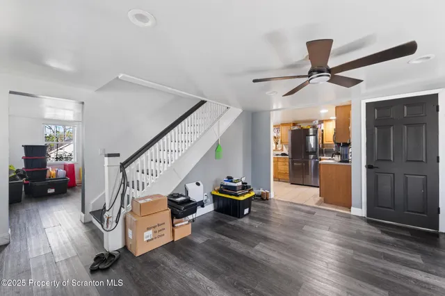 a view of an entryway and livingroom with furniture