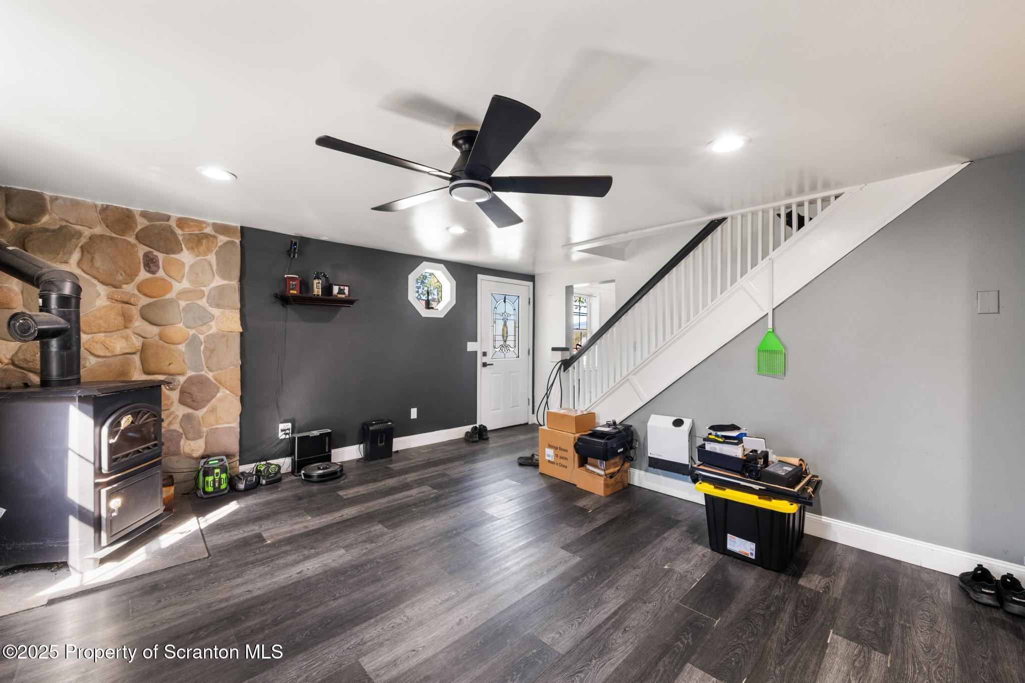 22 Creamery Road Tunkhannock, PA 18657 - Photo 7 of 39 a room with wooden floor and a ceiling fan