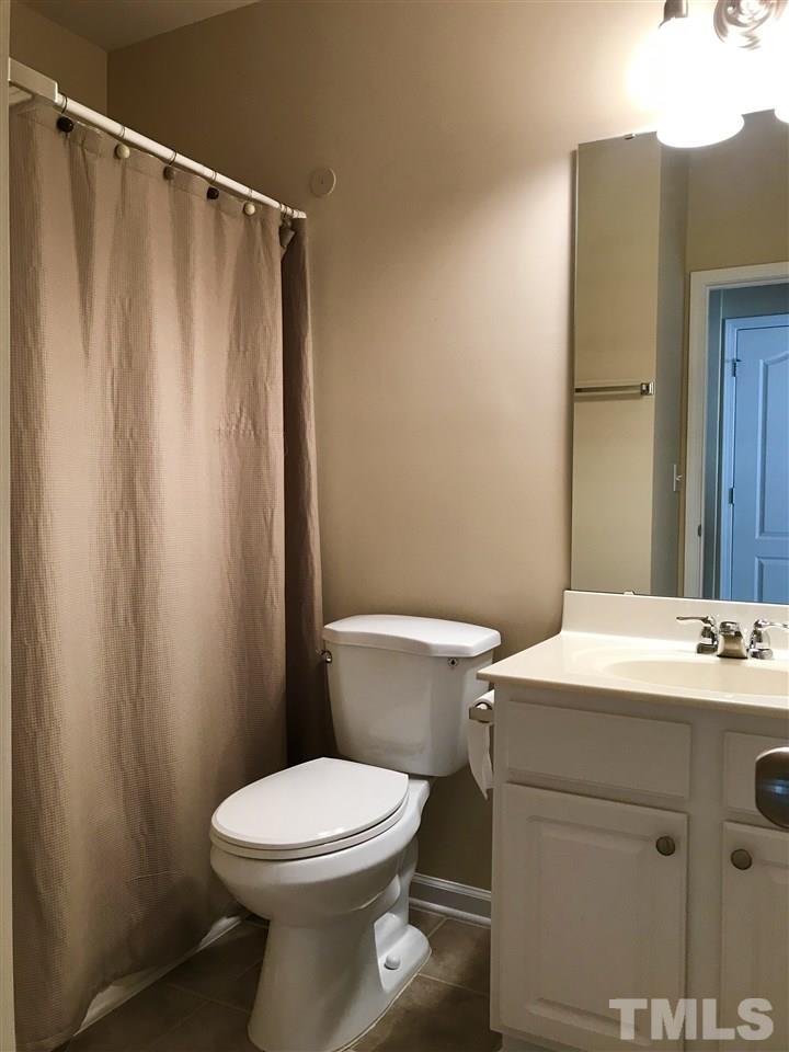 3409 Secretariat Way Raleigh, NC 27614 - Photo 24 of 30 Every bedroom has a full bathroom, one bathroom is accessible from a hall in the living room for guest access.