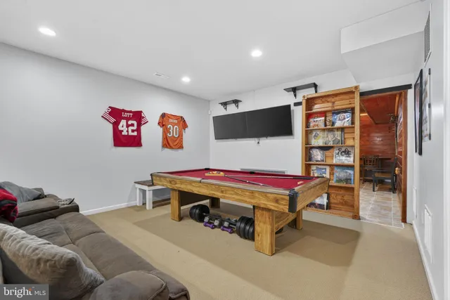 a room with a bed and a flat screen tv