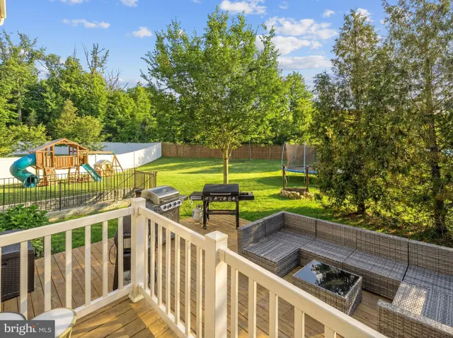 a view of a chairs and table in the balcony
