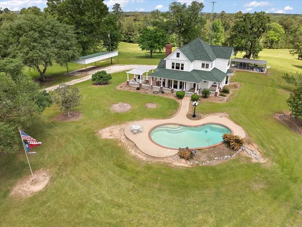 a view of a lake with a swimming pool