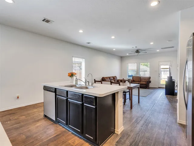 a view of a living room and a wooden floor