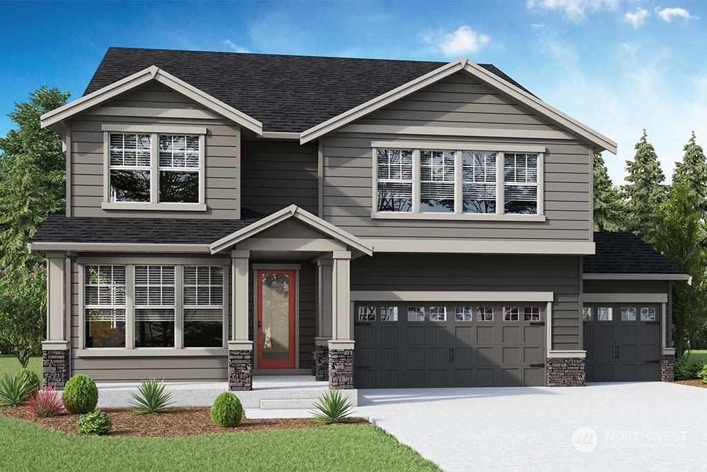 16213 Southeast 133rd Place, Unit 113 Renton, WA 98059 - Photo 1 of 30 a front view of a house with a yard