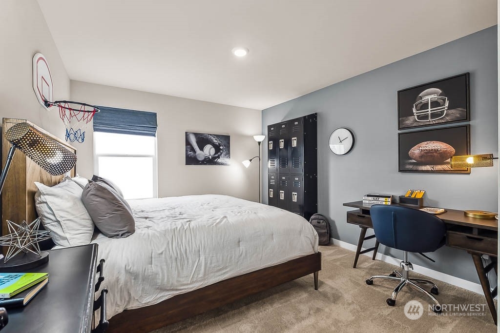 16213 Southeast 133rd Place, Unit 113 Renton, WA 98059 - Photo 20 of 30 a bedroom with a bed and a desk
